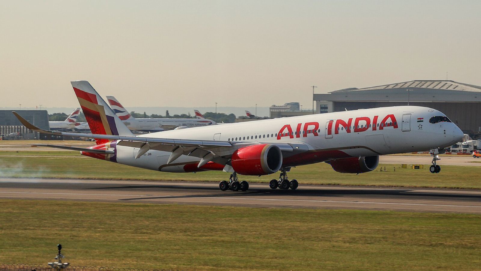 Air India Airbus A350-900 in the new red, purple and gold livery taking off