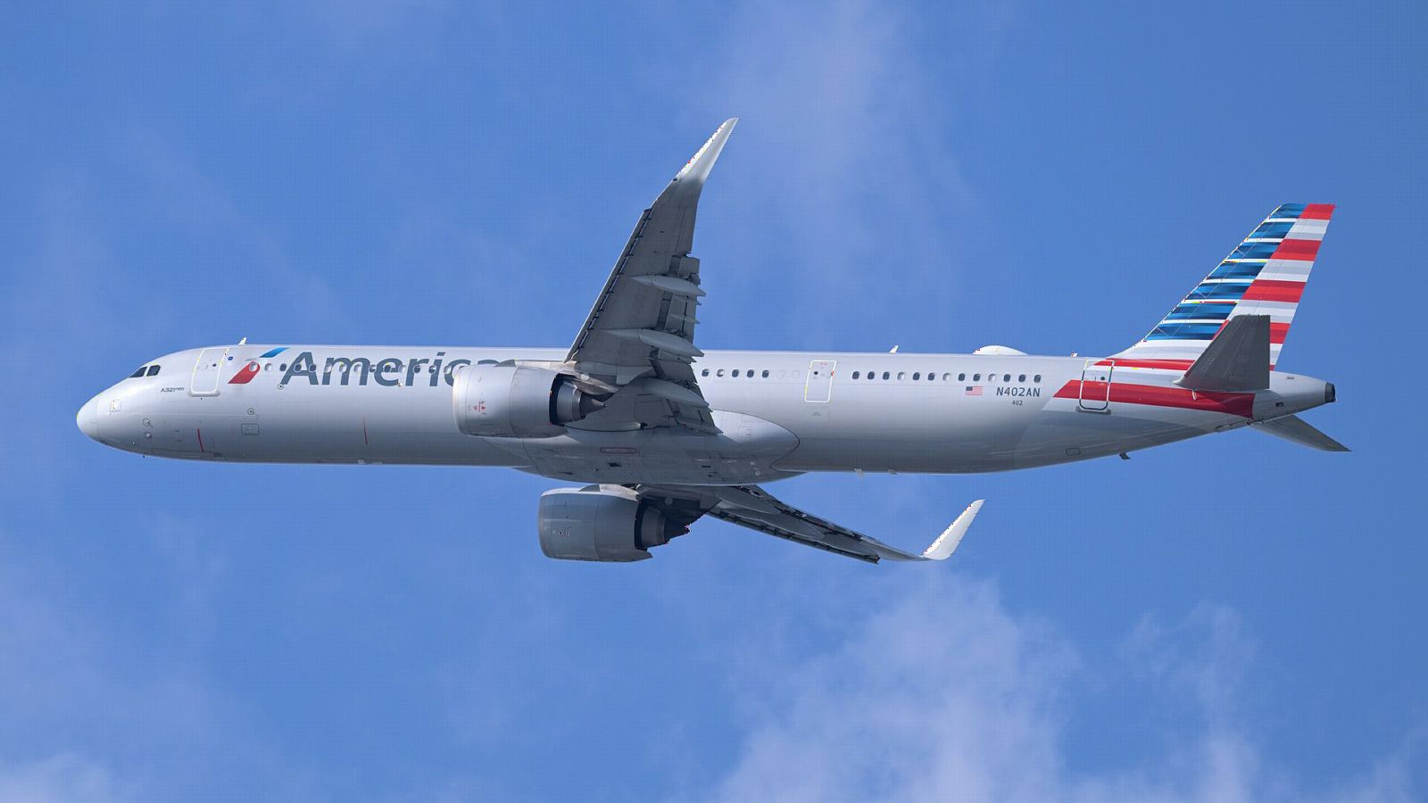 American Airlines Airbus A321neo climbing into a clear blue sky