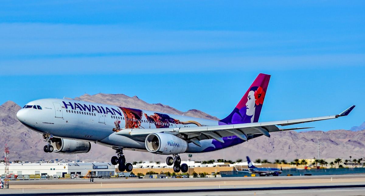 Hawaiian Airlines Airbus A330 landing with desert mountains in the background