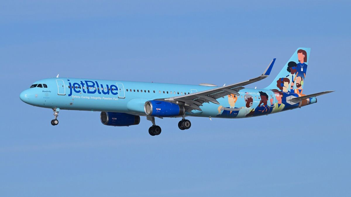 JetBlue Airbus A321 in a special illustrated livery on final approach