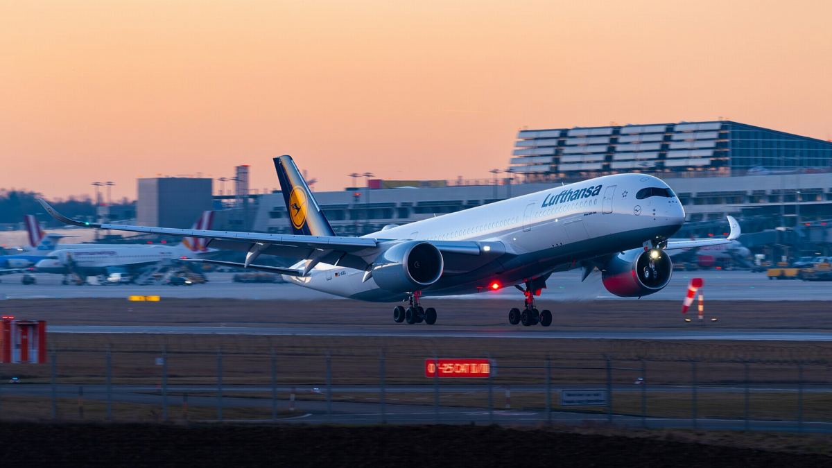 Lufthansa Airbus A350-900 landing at sunset