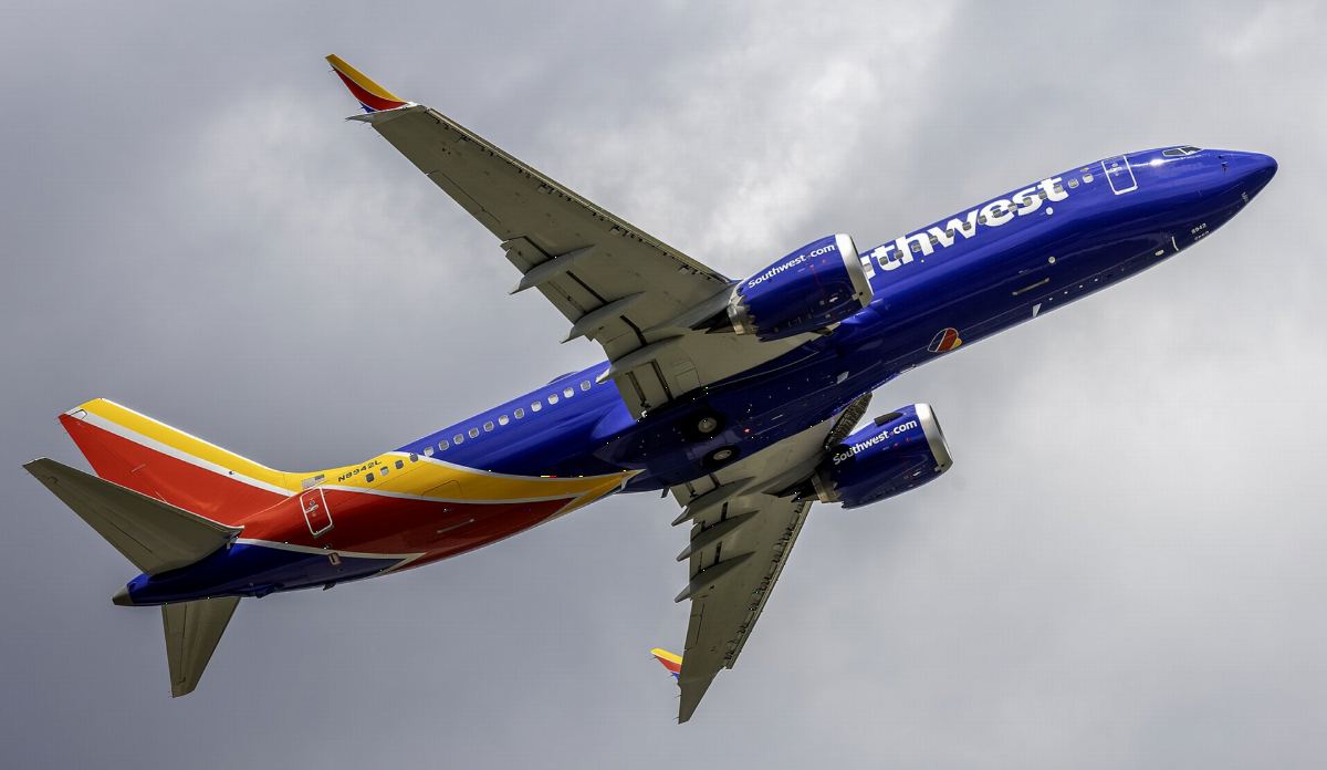 Underside of a Southwest Airlines Boeing 737 MAX 8 in its blue, red and yellow livery